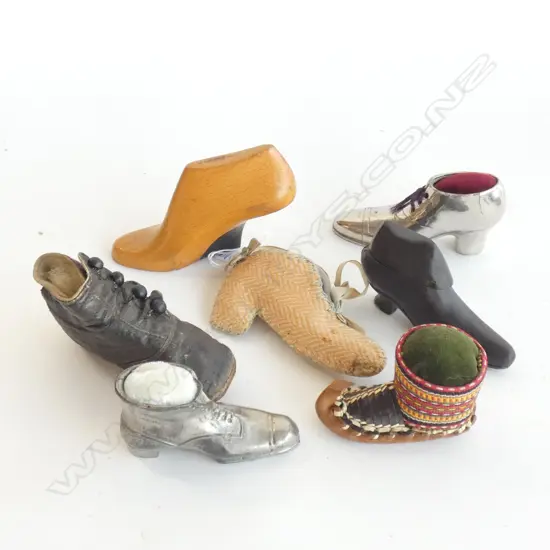 Seven vintage miniature shoes, four as pin cushions.
